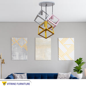 Three metal chandelier in different colors