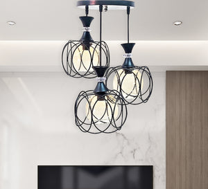 Triple chandelier suspended from the ceiling with a modern design