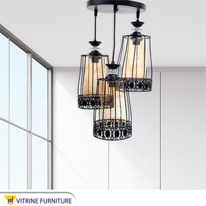 Black chandelier with clear honey glass