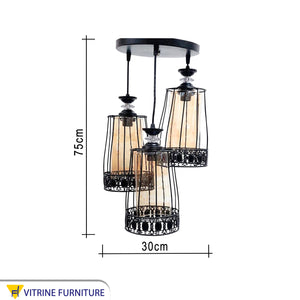 Black chandelier with clear honey glass