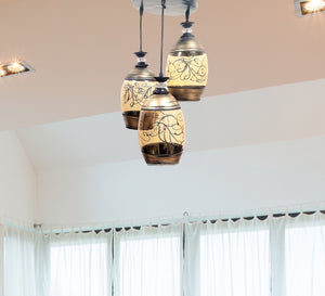 Modern triple chandelier of different lengths