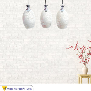 Silver and decorated white glass Triple chandelier