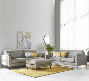 2 modern sofas in light grey + puff