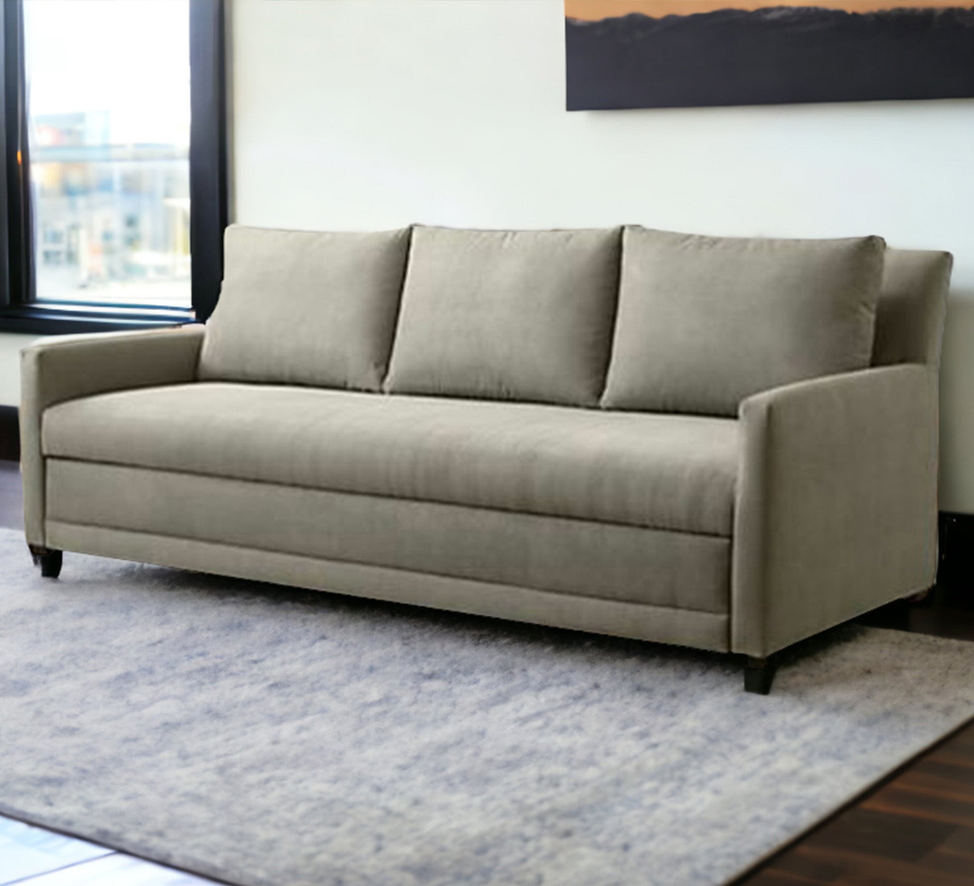 A sofa with three back cushions