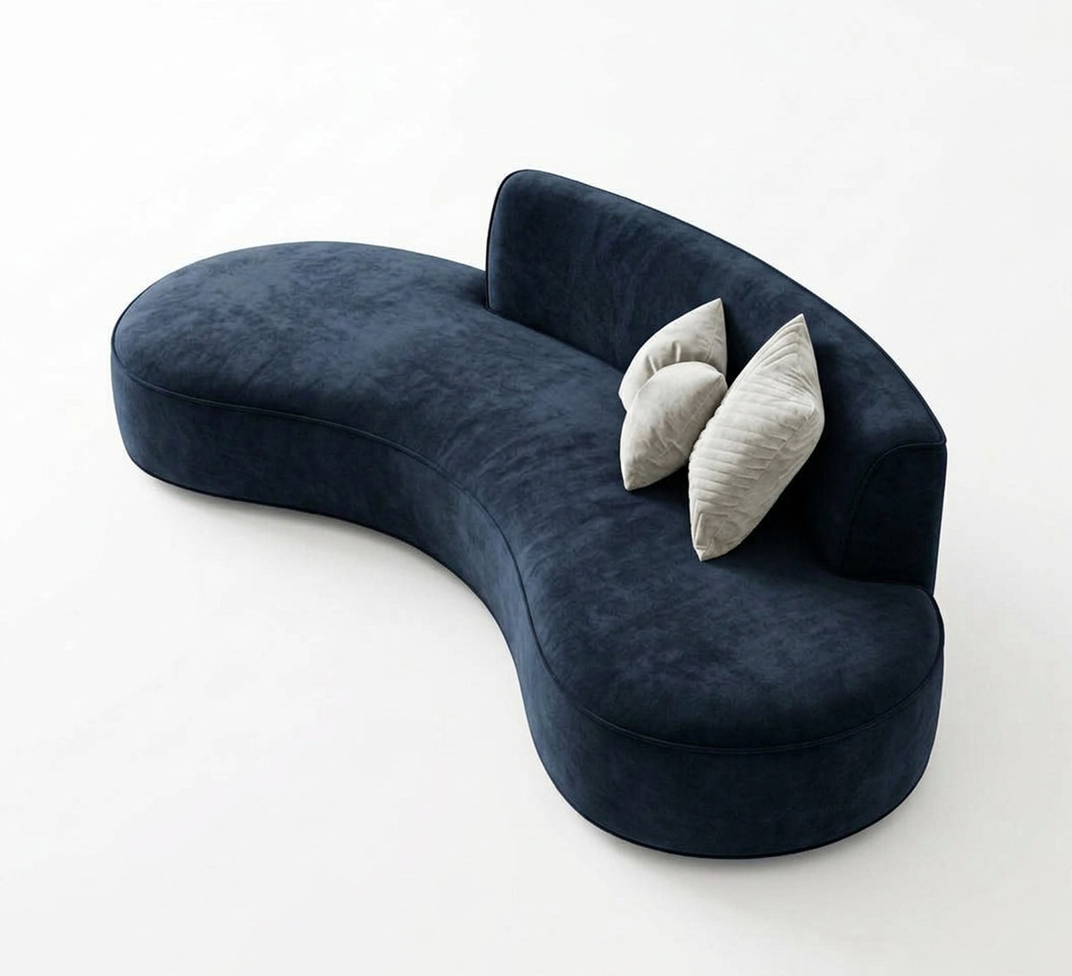 A modern curved sofa with comfortable cushions.