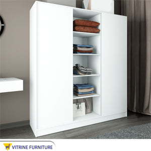 A cupboard with three sliding doors