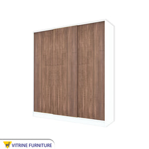 A three-leaf brown sliding wardrobe