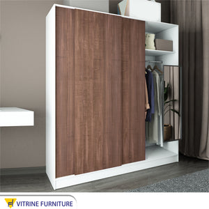 A three-leaf brown sliding wardrobe