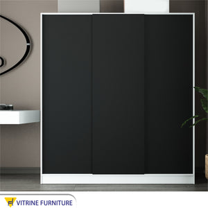 Sliding wardrobe with three doors in black