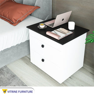 Nightstand with a black moving surface