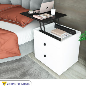 Nightstand with a black moving surface