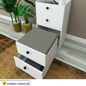 Dresser with movable top and seat