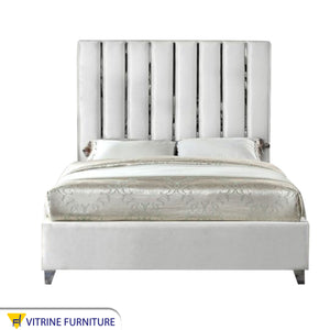 Single bed with longitudinal silver steel ornaments