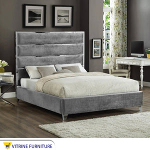 Light gray bed with velvet back