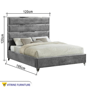 Light gray bed with velvet back