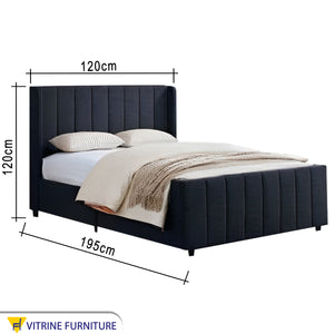 Black royal bed with upholstery divided lengthwise