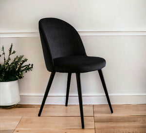 Upholstered chair with arched back