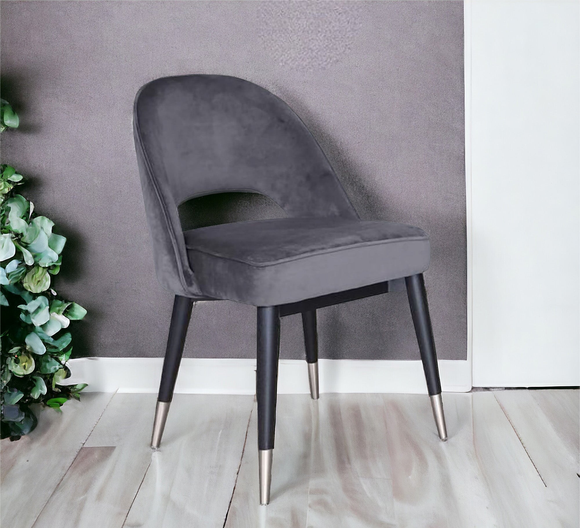 Round back chair upholstered in dark grey