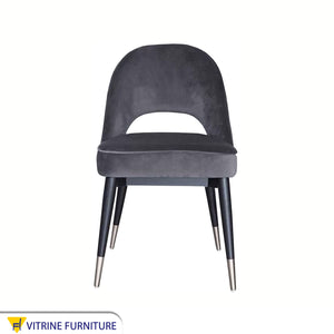 Round back chair upholstered in dark grey