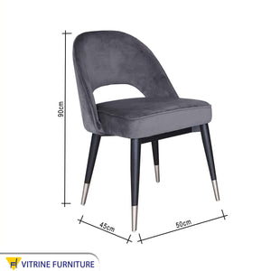 Round back chair upholstered in dark grey