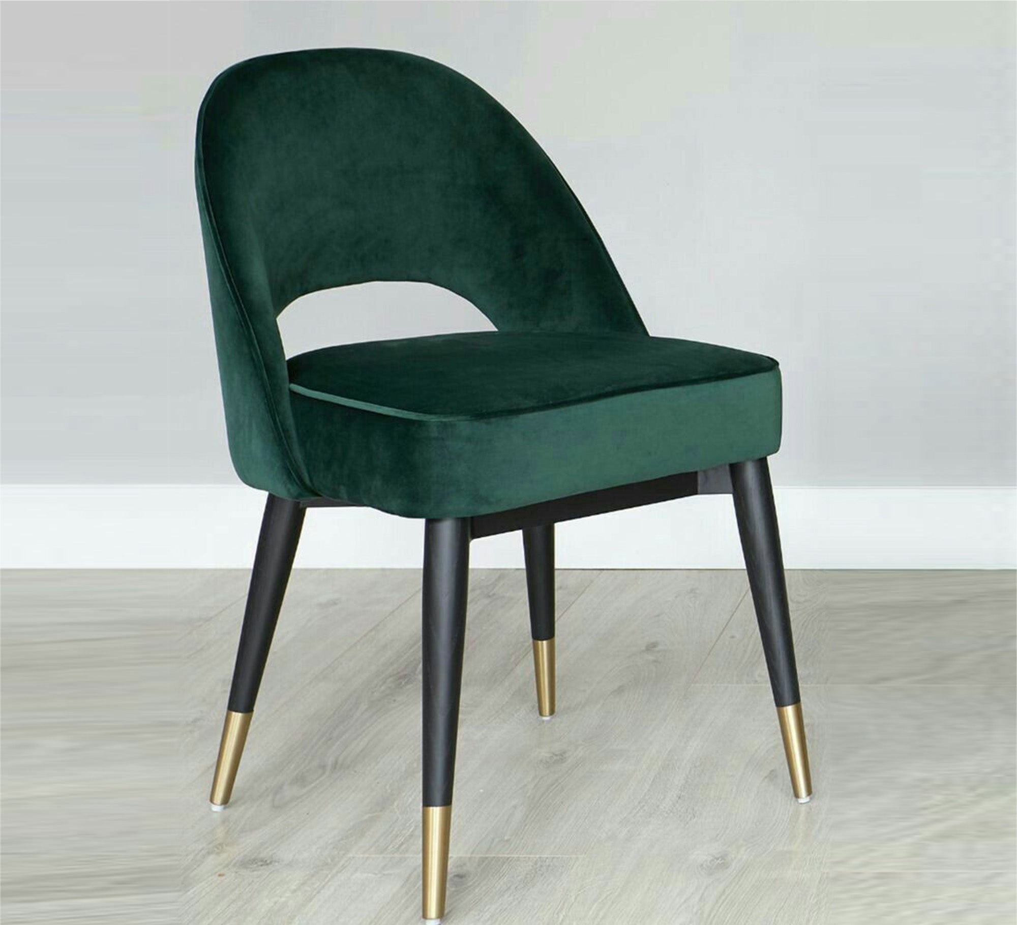 Round back chair upholstered in drak green