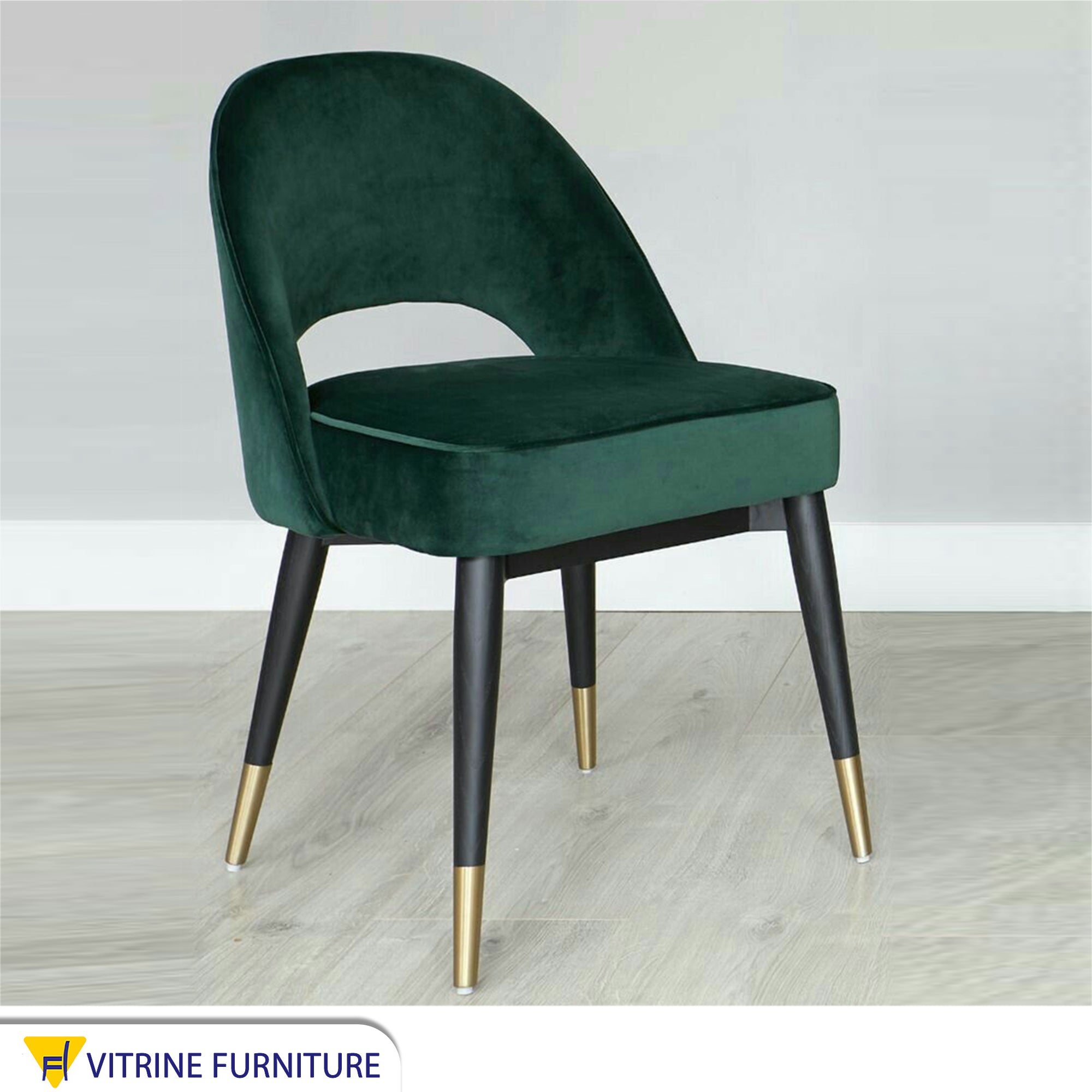 Round back chair upholstered in drak green
