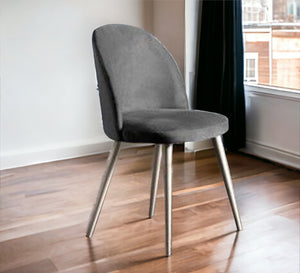 Round back chair upholstered in grey