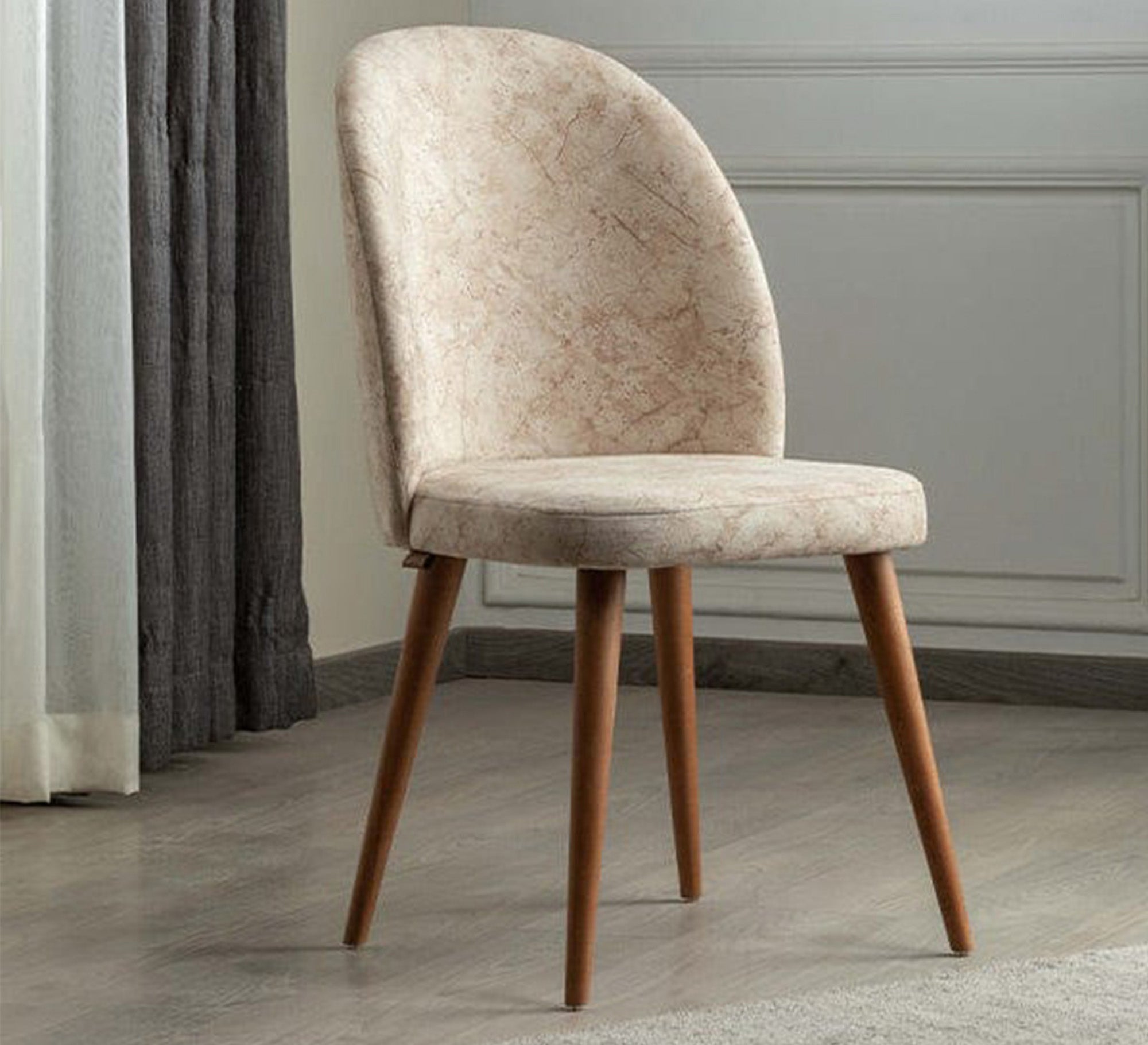 A chair upholstered in patterned fabric