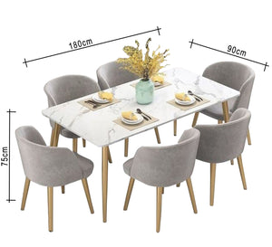 A rectangular dining table with six chairs