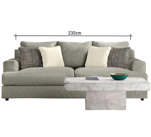 A grey sofa with a pair of base cushions