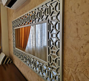 Mirror with a wide hollow wooden frame