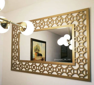 Mirror with a wide hollow wooden frame