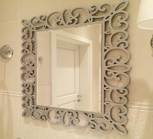 Mirror with a decorative hollow wooden frame