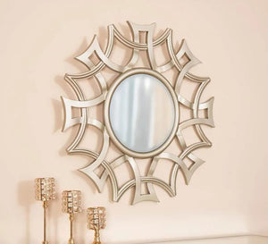 A circular mirror with a frame of hollow overlapping circles