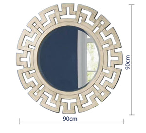 A circular mirror with a frame of hollow overlapping circles