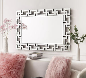 Rectangular mirror with a frame of geometric shapes