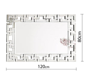 مرآة مستطيلة مع إطار من الأشكال الهندسية