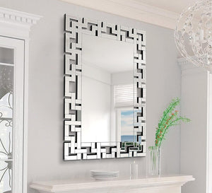 Rectangular mirror with a frame of geometric shapes