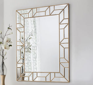 A rectangular mirror with two frames one of which is hollow wood