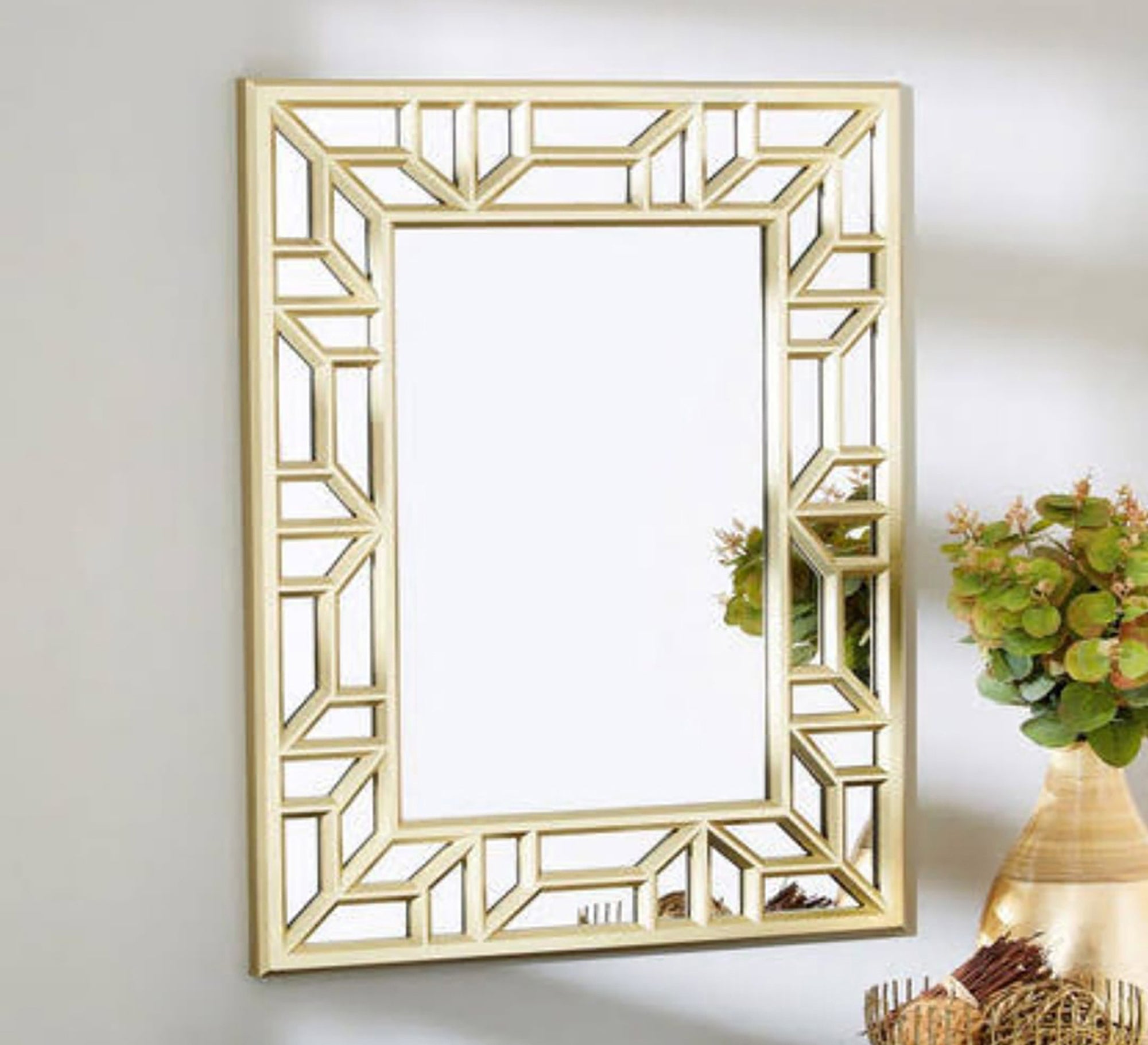 A rectangular mirror with two frames one of which is hollow wood