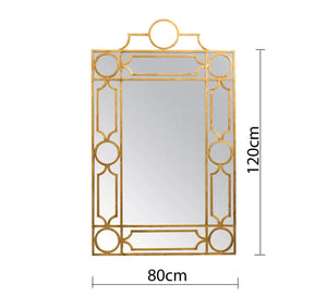 A rectangular mirror with a frame decorated with hollow circles