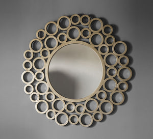 A circular mirror with a frame of multiple wooden circles