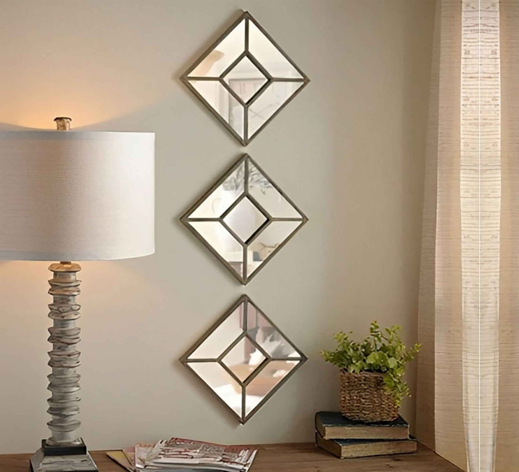 Three square mirrors arranged vertically