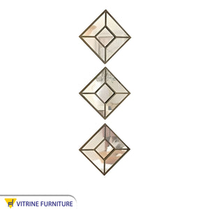 Three square mirrors arranged vertically