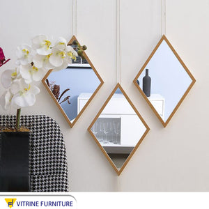 Three diamond-shaped mirrors arranged alternately