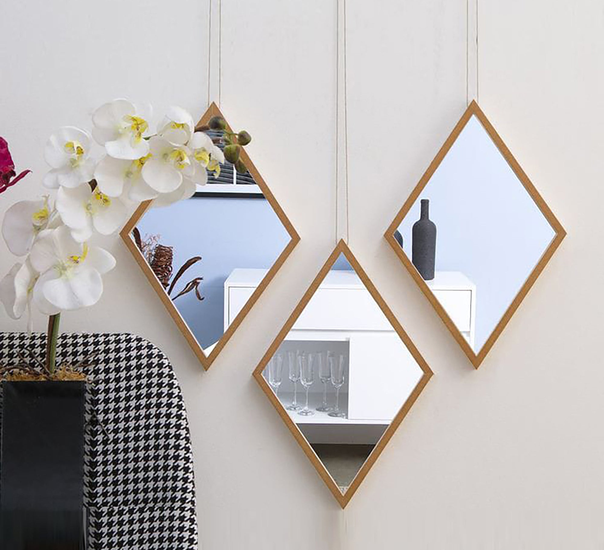 Three diamond-shaped mirrors arranged alternately