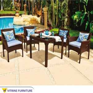 Outdoor seating set made of brown synthetic rattan