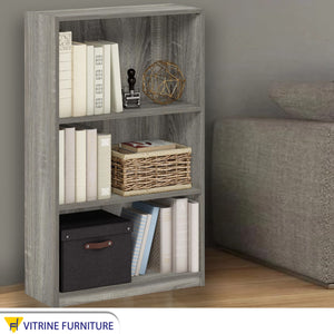 Gray wooden bookcase