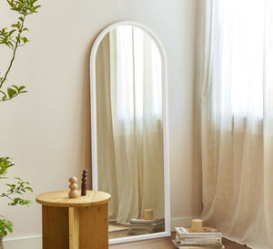 Modern mirror with a semicircular frame at the top