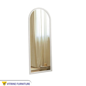Modern mirror with a semicircular frame at the top